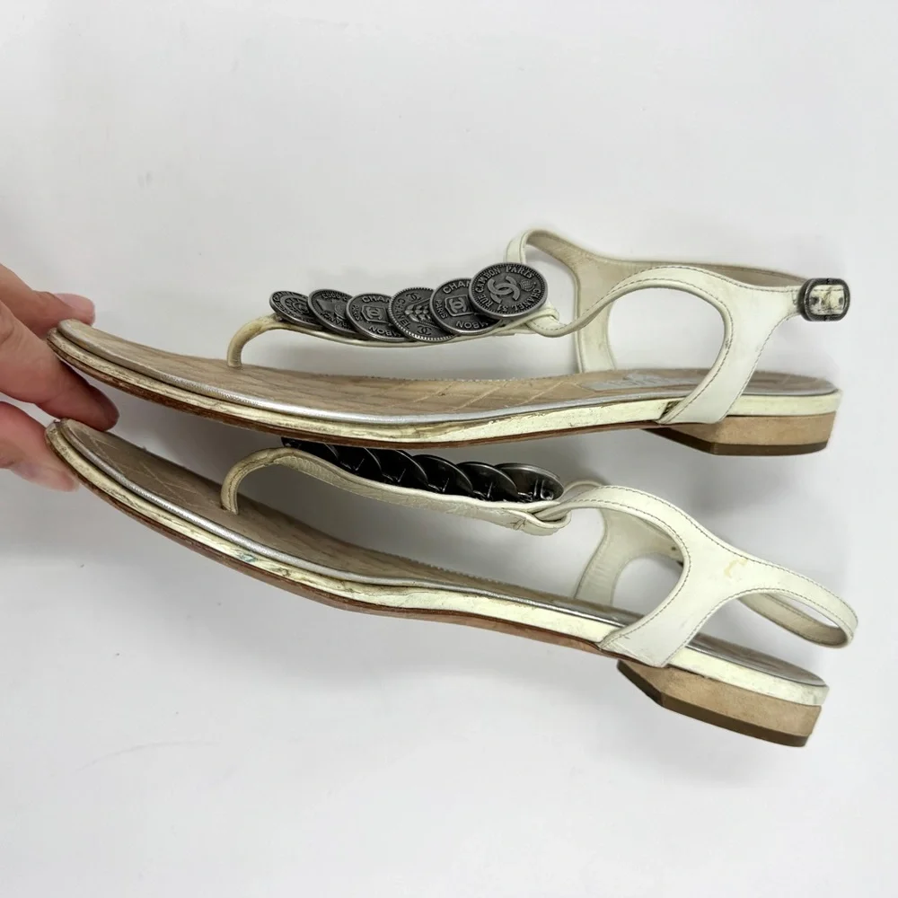 CHANEL White Leather Thong Sandals with Stacked Silver Coin Medallions